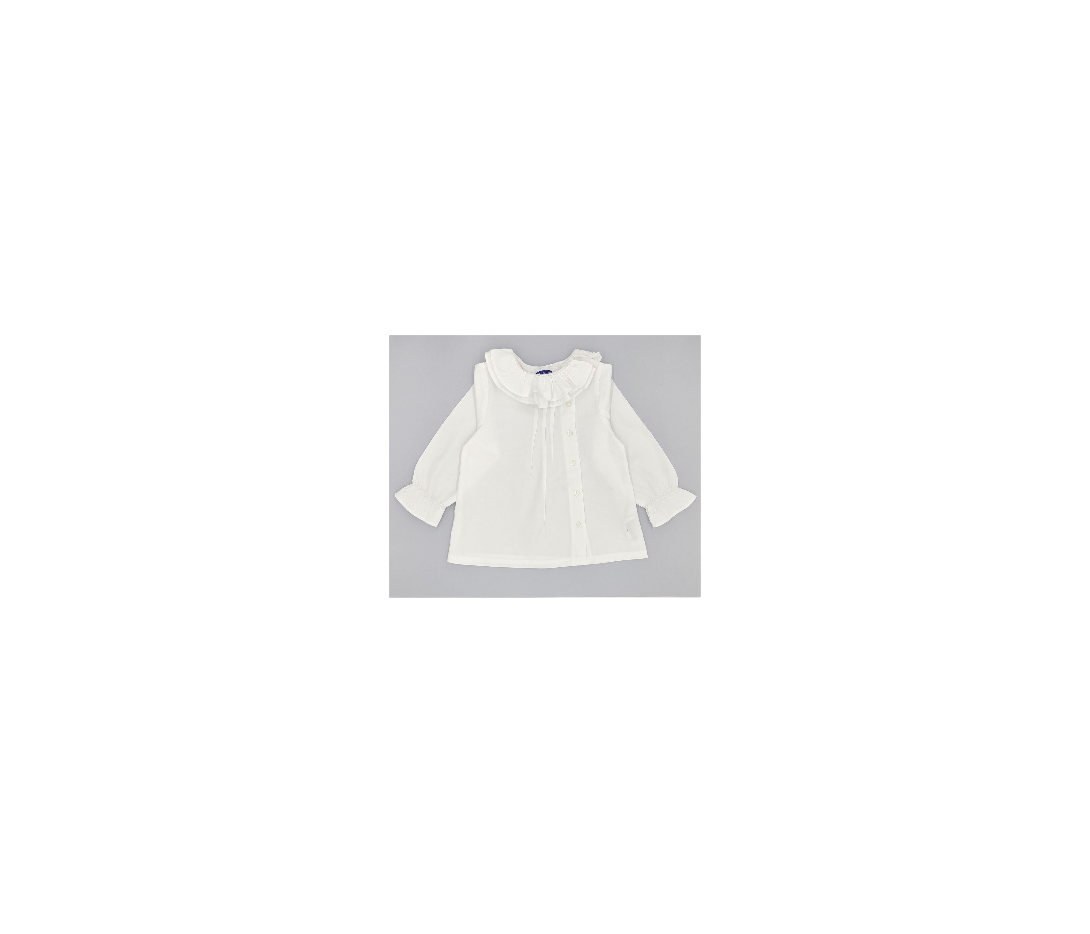 BLUSA NIÑA BOTONES CUELLO VOLANTE VILLELA BLANCO